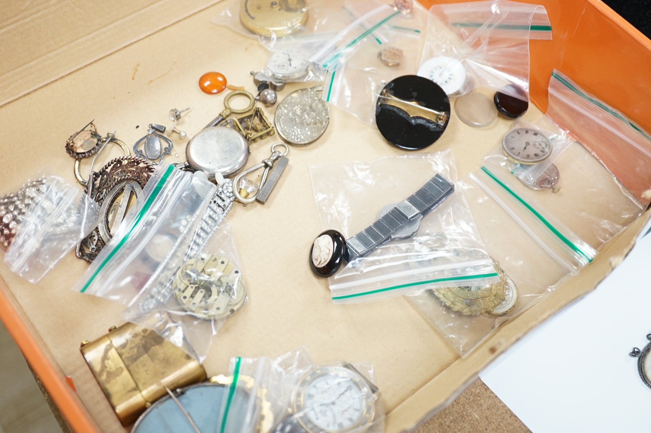 A quantity of assorted costume jewellery and watch movements.